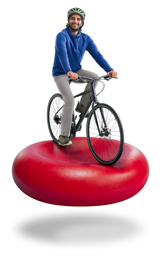 Man riding a bicycle on red blood cell